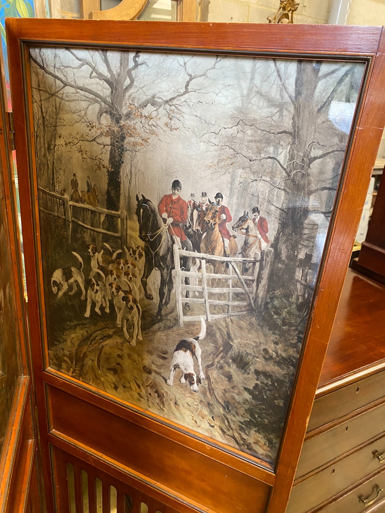 An Edwadian mahogany two fold screen inset with printed hunting scenes, each panel width 54cm, height 156cm